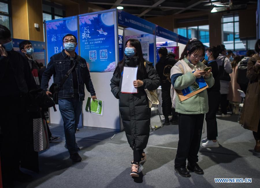 Job seekers attend a job fair at the Hongshan Gymnasium in Wuhan, central China's Hubei Province, Dec. 2, 2020. A national colleage graduates employment and entrepreneurship promotion fair kicked off here on Wednesday. Over 500,000 jobs vacancies were offered to applicants. (Xinhua/Xiao Yijiu)