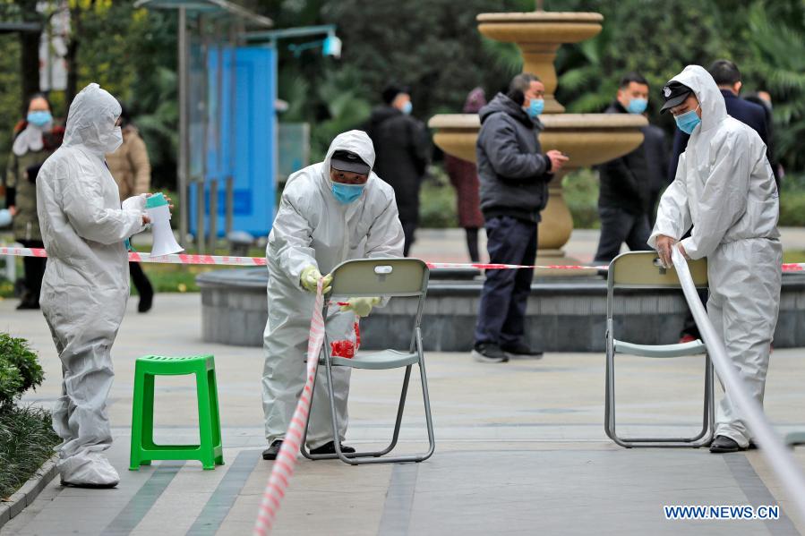 Property management staff set up a temporary nucleic acid testing station at a community in Pidu District of Chengdu, southwest China's Sichuan Province, Dec. 11, 2020. By 6 p.m. Friday, Chengdu, capital of Sichuan Province, had reported 10 confirmed COVID-19 cases and two asymptomatic cases in the recent emergence of the epidemic, said Xie Qiang, director of the municipal health commission. Parts of a residential compound in Chengdu's Pidu District were classified as medium-risk areas for COVID-19 starting from 9 p.m. on Thursday. (Xinhua/Shen Bohan)