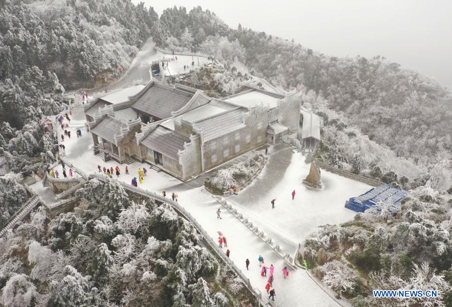 Aerial photo shows people having fun at the snow covered Hengshan Mountain scenic area in Hengyang, central China's Hunan Province, Dec. 15, 2020. (Photo by Cao Zhengping/Xinhua)