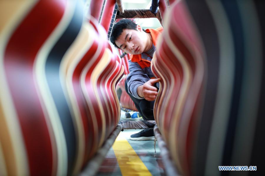 A worker examines products at a guitar industrial park in Zheng'an County of Zunyi, southwest China's Guizhou Province, Oct. 18, 2020. The year 2020 is a juncture where China is wrapping up the plan for the 2016-2020 period and preparing for its next master plan. In 2020, China stepped up efforts to shore up weak links regarding people's livelihoods. A slew of measures has been rolled out to address people's concerns in employment, education, basic medical services, the elderly care, housing, public services, etc. (Xinhua/Liu Xu)