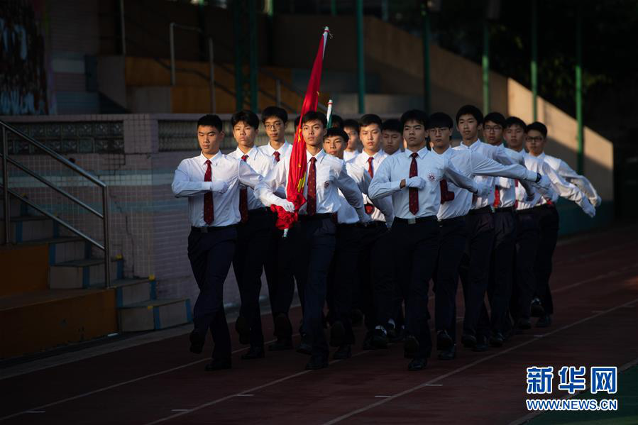 澳门濠江中学举行全校升国旗仪式(2019年11月18日摄).