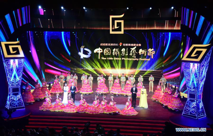 Photo taken on Dec. 20, 2020 shows the opening ceremony of the 13th China Photography Festival in Sanmenxia City of central China's Henan Province. The 13th China Photography Festival kicked off on Dec. 20 in the city of Sanmenxia in central China's Henan Province. This year's festival carries the theme of the country's fight against poverty and the COVID-19 epidemic. (Xinhua/Zhu Xiang)