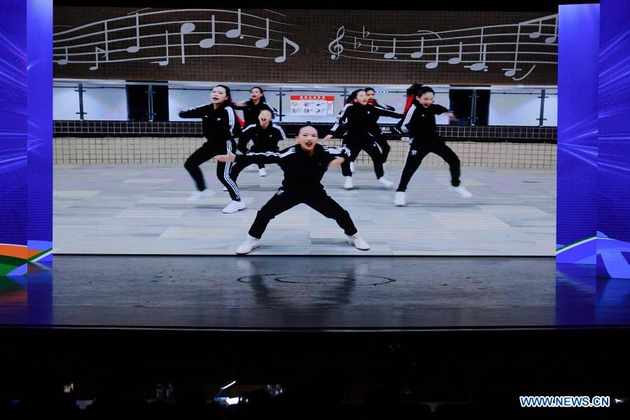 Dancers from southeast China's Taiwan perform via video link during the finals of a cross-Strait Hip Hop dance championship for teenagers in Fuzhou, southeast China's Fujian Province, Dec. 20, 2020. The final round of the championship kicked off here on Sunday, with teenagers from both sides of the Taiwan Strait attending the competition on-site or on-line. (Xinhua/Song Weiwei)