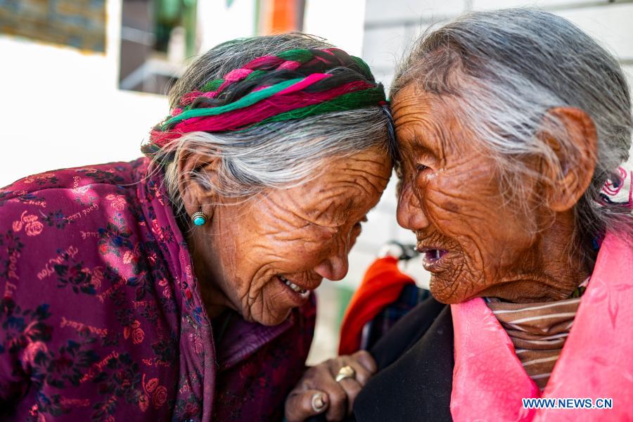 Sonam Drolma (R), 109, interacts with her sister in Reguo Village of Gyaca County in Shannan, southwest China's Tibet Autonomous Region, March 24, 2020. The average life expectancy in Tibet has risen to 70.6 years, a senior Chinese health official said on Dec. 15, 2020. The autonomous region has also witnessed significant improvements in key health indicators including the infant and children mortality rate, the maternal mortality rate and the hospital delivery rate over the last five years, said Li Dachuan from the National Health Commission at a press conference. Before democratic reform in 1959, the average life expectancy in Tibet was just 35.5 years. (Xinhua/Purbu Zhaxi)