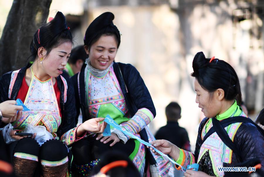 Women of the Miao ethnic group study embroidery at the workshop in Basha Village of the Miao ethnic group of Congjiang County, southwest China's Guizhou Province, Nov. 13, 2020. Training bases and workshops of embroidery and batik have been set up in Congjiang County with the assistance from Yunyan District of Guiyang City. China has made great achievements in poverty relief that has impressed the world, with almost 100 million people lifted out of poverty. (Xinhua/Yang Wenbin)