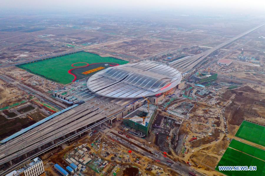 Aerial photo taken on Dec. 20, 2020 shows the construction site of Beijing-Xiongan intercity railway's Xiongan Railway Station in Xiongan New Area, north China's Hebei Province. The construction of Beijing-Xiongan intercity railway's Xiongan Railway Station has entered the final stage and the station will be put into operation by the end of this year. (Xinhua)