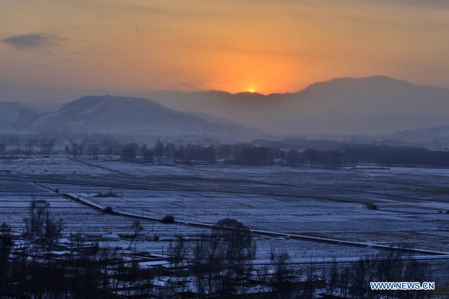 Photo taken on Dec. 29, 2020 shows the snow scenery of Dengshan Village in Zhangyi Town of Wuwei City, northwest China's Gansu Province. (Photo by Jiang Aiping/Xinhua)