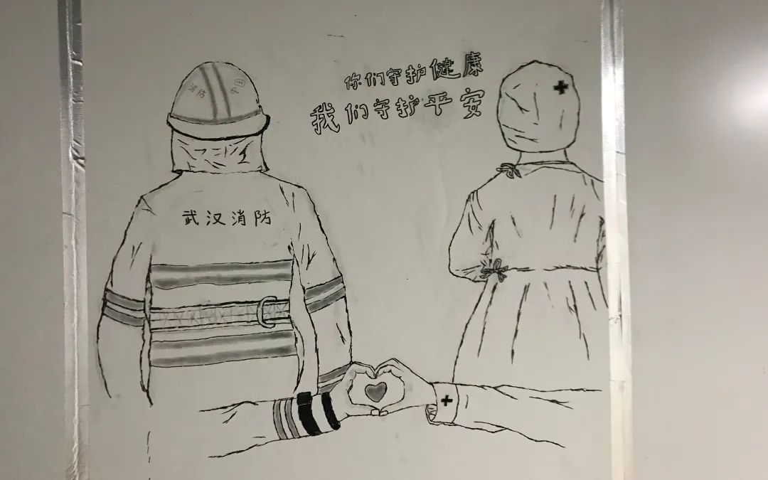 雷神山医院走廊涂鸦墙上的卡通画。受访者供图