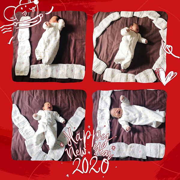 3月17日,妻子用手机给孩子拍满月照.