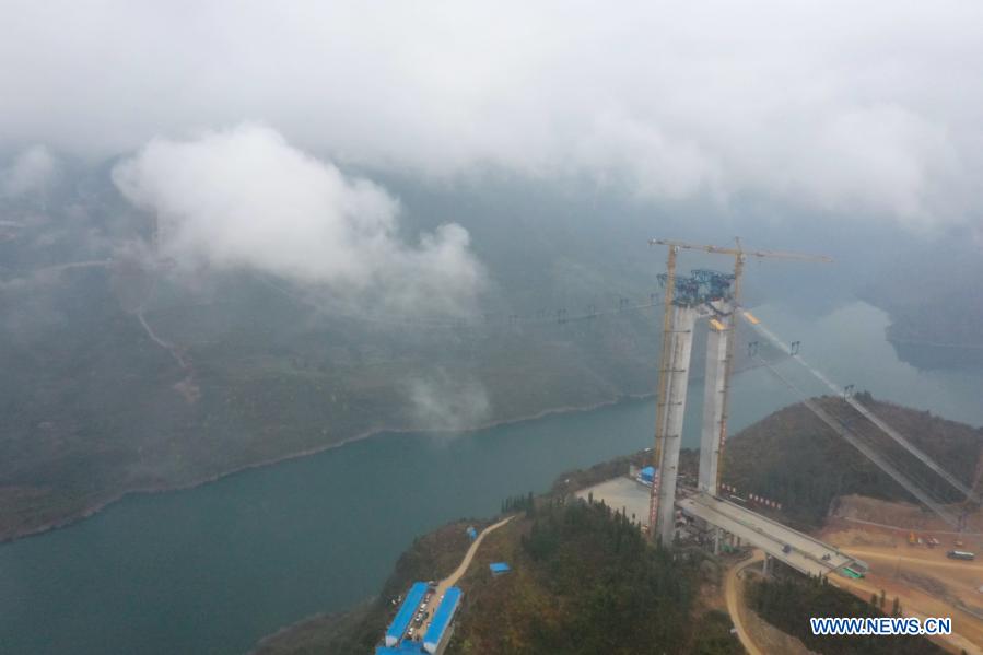 Aerial photo taken on Jan. 5, 2021 shows the Kaizhou Lake grand bridge under construction in southwest China's Guizhou Province. The Kaizhou Lake grand bridge is part of the Weng'an-Kaiyang expressway. With a main span of 1,100 meters, the bridge is 1,257 meters in length and one of its main towers is 139 meters in height. (Xinhua/Liu Xu)