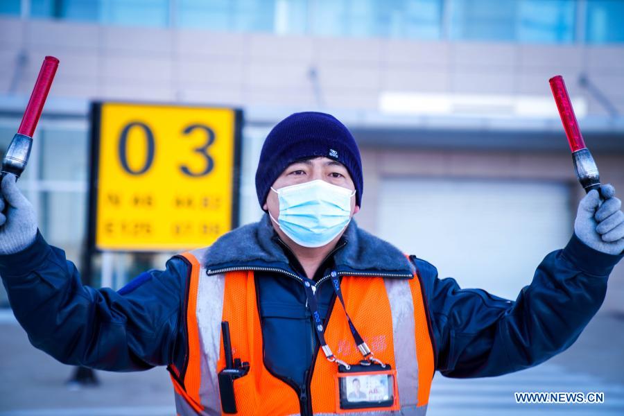 Guo Xin, leader of the aircraft maintenance team of Daqing Saertu Airport, works at the airport in Daqing, northeast China's Heilongjiang Province, Jan. 8, 2021. To ensure the smooth and safe operation of the airport, aircraft maintenance engineers here worked hard despite the low temperature of about minus 30 degrees Celsius. (Xinhua/Wang Song)
