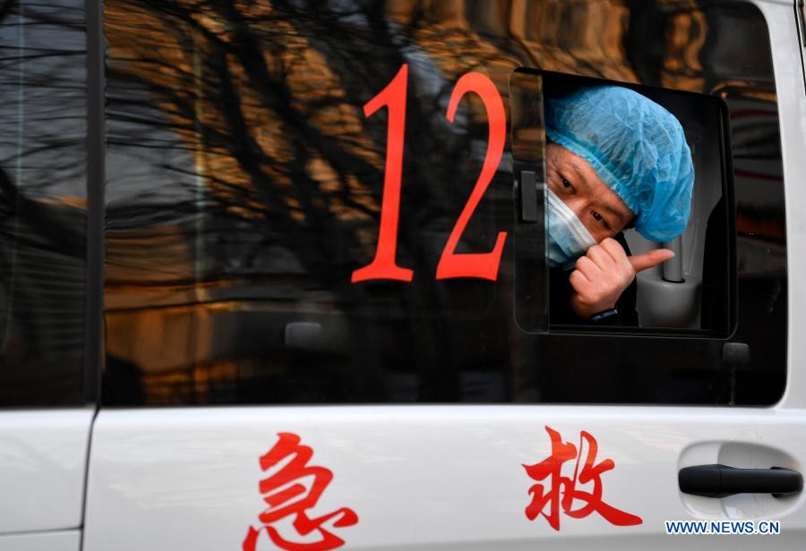 A member of a medical team thumbs up to indicate his confidence before leaving for Hebei Province at Tianjin Emergency Center in Tianjin, north China, Jan. 11, 2021. As the second wave of medical emergency aid from Tianjin to Hebei Province, the team consists of 87 members, flanked by 20 ambulances and two other vehicles loaded with supplies for epidemic prevention and control. (Xinhua/Li Ran)