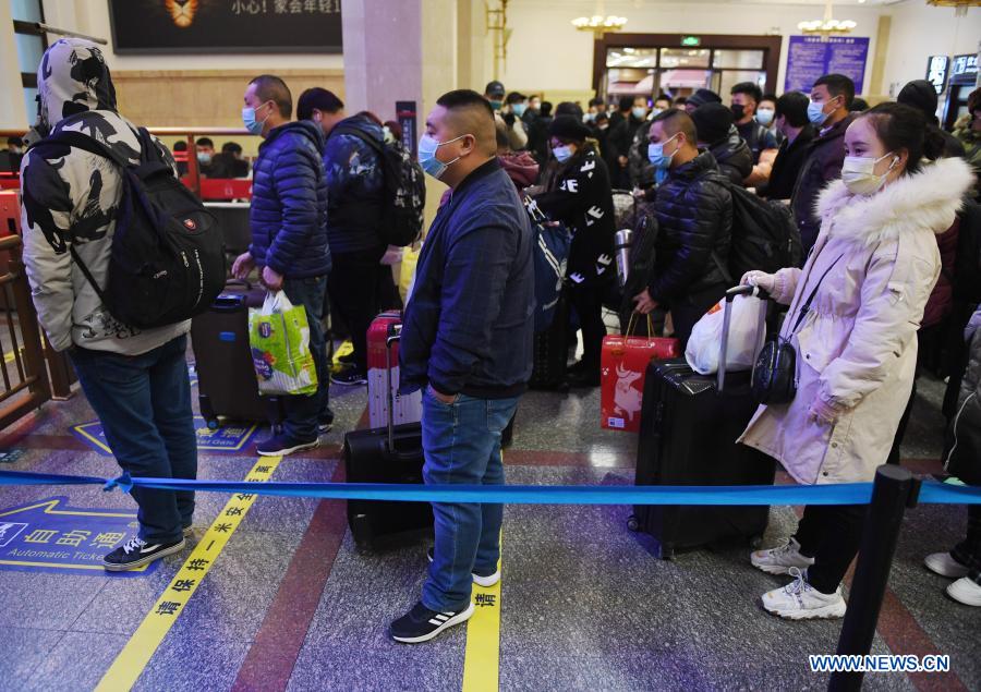 Passengers wait to check in at the Beijing Railway Station, in Beijing, capital of China, Jan. 28, 2021. The Spring Festival travel rush, known as the world's largest annual human migration, lasts 40 days from Jan. 28 to March 8 this year. (Xinhua/Zhang Chenlin)