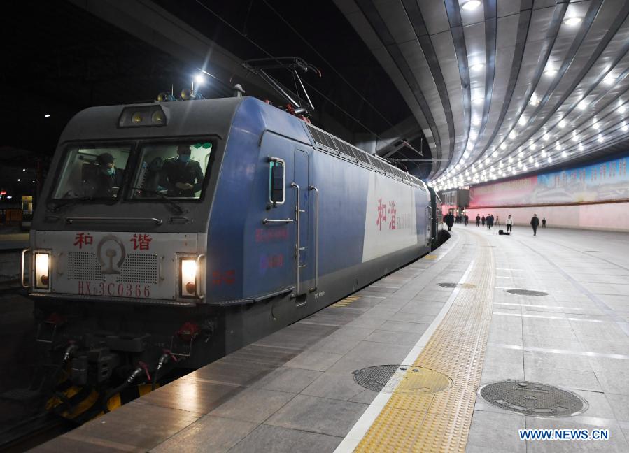 The train 3603 from Beijing to Chongqing parks at the Beijing Railway Station, in Beijing, capital of China, Jan. 28, 2021. The Spring Festival travel rush, known as the world's largest annual human migration, lasts 40 days from Jan. 28 to March 8 this year. (Xinhua/Zhang Chenlin)