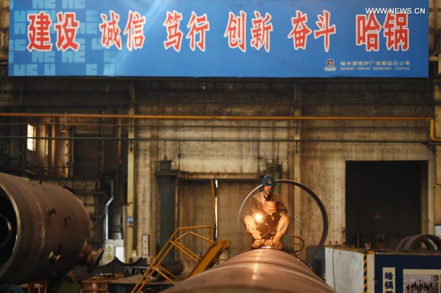 A worker is busy at a workshop of Harbin Boiler Co., Ltd. in Harbin, capital of northeast China's Heilongjiang Province, Feb. 23, 2021. (Xinhua/Wang Jianwei)