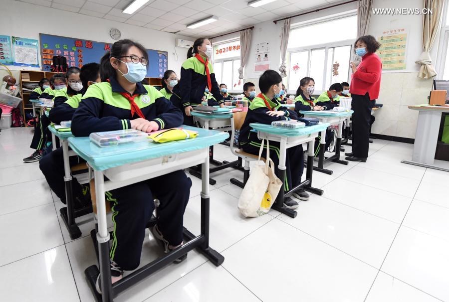 Students have class at Beijing Taipinglu Primary school in Haidian District of Beijing, capital of China, March 1, 2021. Middle school and primary school students returned to school as scheduled for the spring semester in Beijing on Monday amid coordinated epidemic control efforts. (Xinhua/Ren Chao)