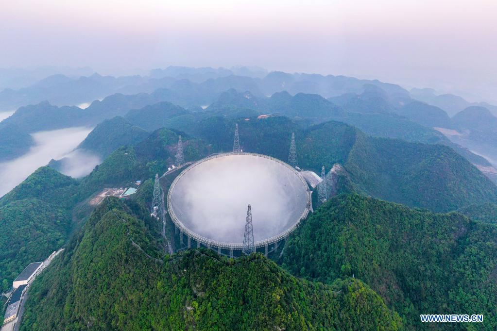 Aerial photo taken on March 31, 2021 shows China's Five-hundred-meter Aperture Spherical Radio Telescope (FAST) under maintenance in southwest China's Guizhou Province. China's FAST officially opened to the world starting Wednesday. (Xinhua/Ou Dongqu)