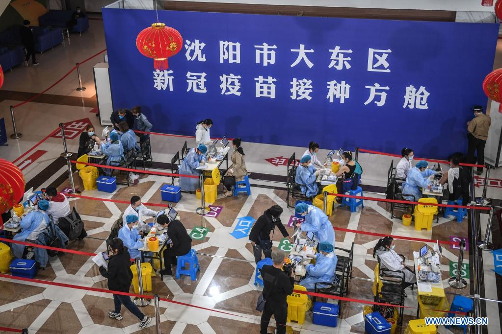 People receive COVID-19 vaccines at a vaccination site in Dadong District of Shenyang, northeast China's Liaoning Province, May 7, 2021. The vaccination site, which was transformed from a sports center, went into service on Friday. Covering 4,000 square meters, the site is divided into 8 areas including temperature measuring area, waiting area, registration area, and etc. (Xinhua/Pan Yulong)