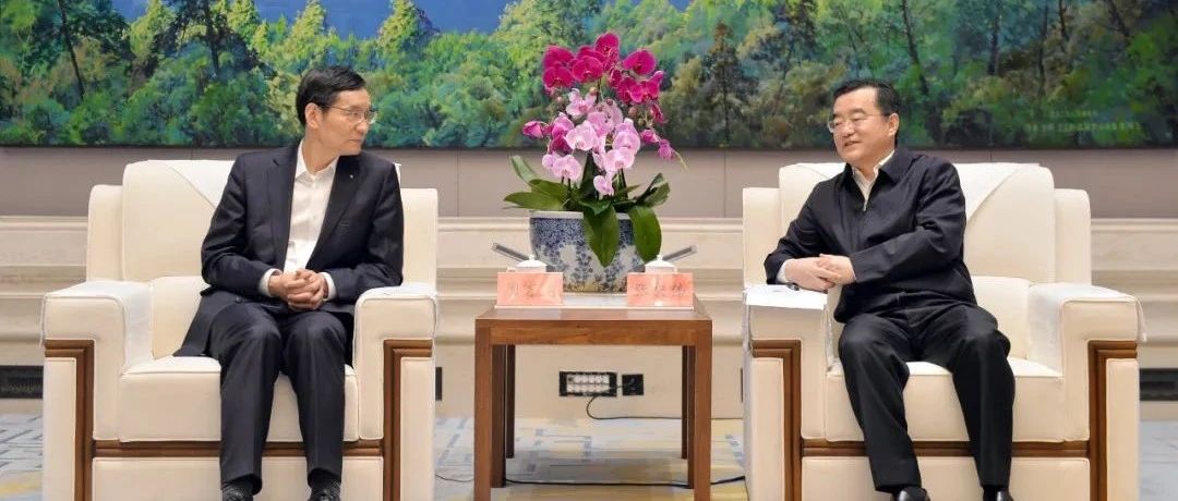 恒泰集团董事长_张庆伟会见中国建材集团党委书记、董事长周育先一行