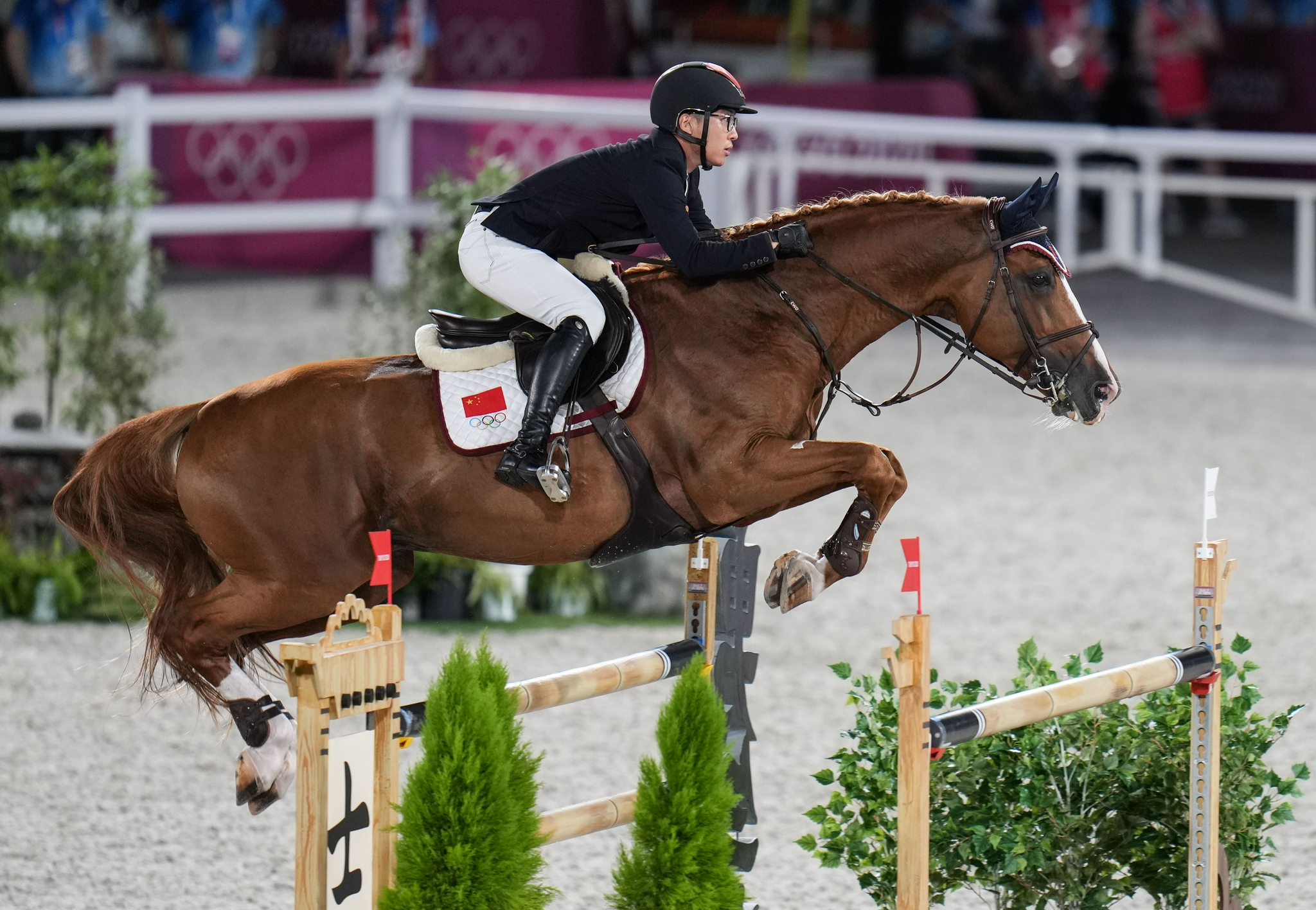 马术——中国运动员参加场地障碍团体比赛
