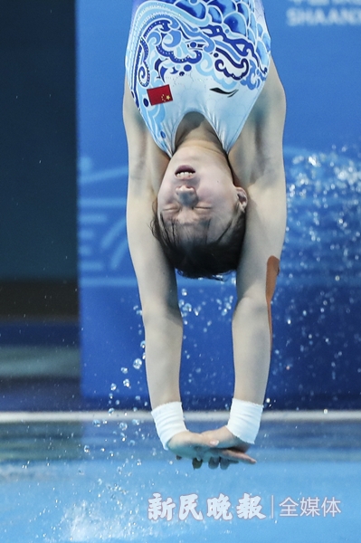 图说:陈芋汐在比赛中 新民晚报记者 李铭珅 摄本届全运会跳水比赛将