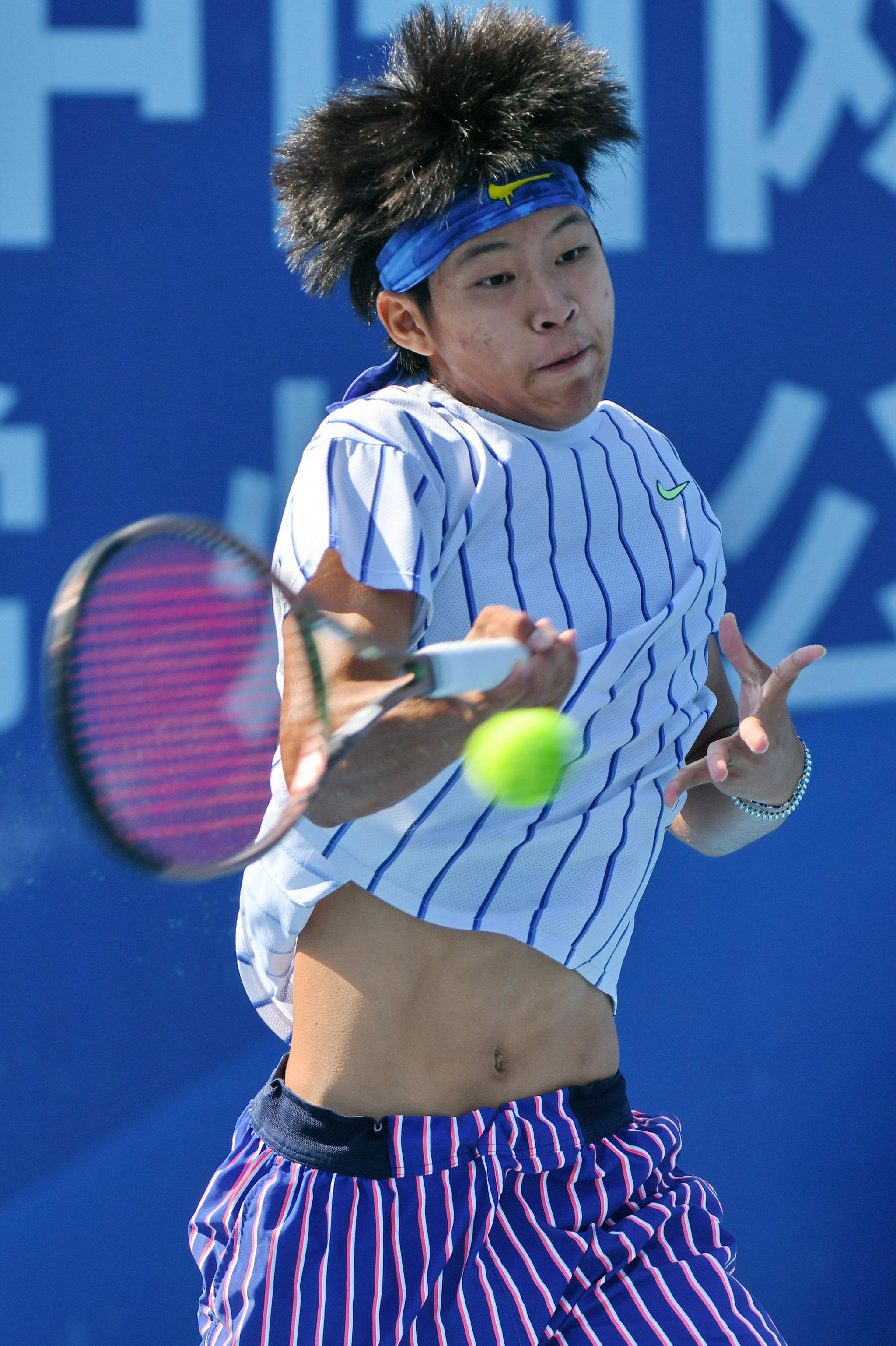 9月21日,张择在比赛中回球.新华社发(史康摄)