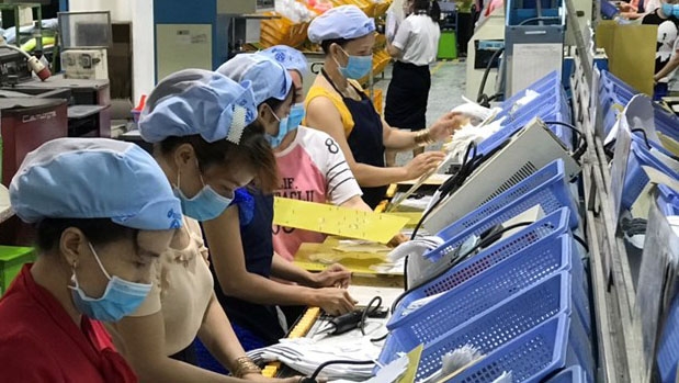A screenshot of a video inside a Nike factory in Vietnam