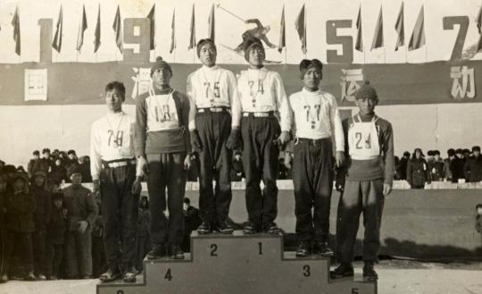 The award ceremony for the first event of the first national ski competition in 1957. The third on the right is Shan Zhaojian.