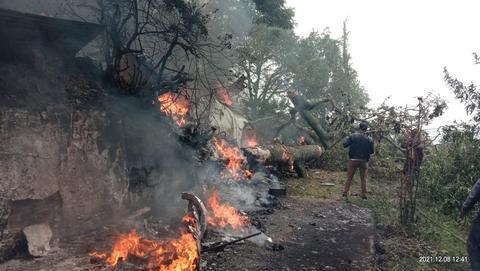 The fuselage caught fire after hitting a big tree