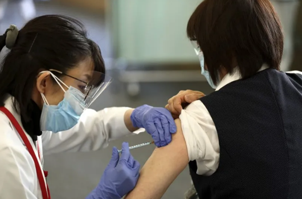 图说：推广接种新冠疫苗对已经推迟举办的东京奥运会而言至关重要。图 GJ