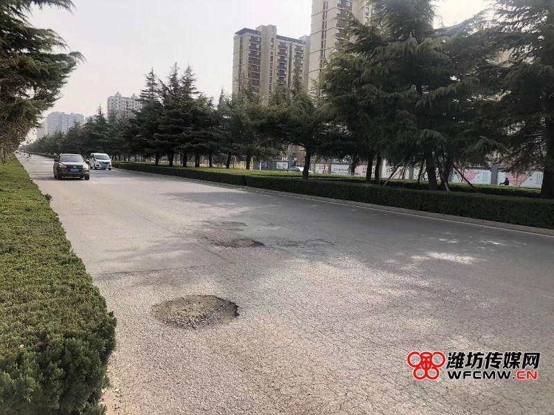 潍坊高新区金马路这段道路坑连坑车辆经过频托底