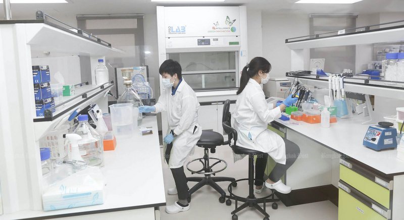 Researchers of Siam Biotech Company work in a laboratory in Bangkok. Picture from: