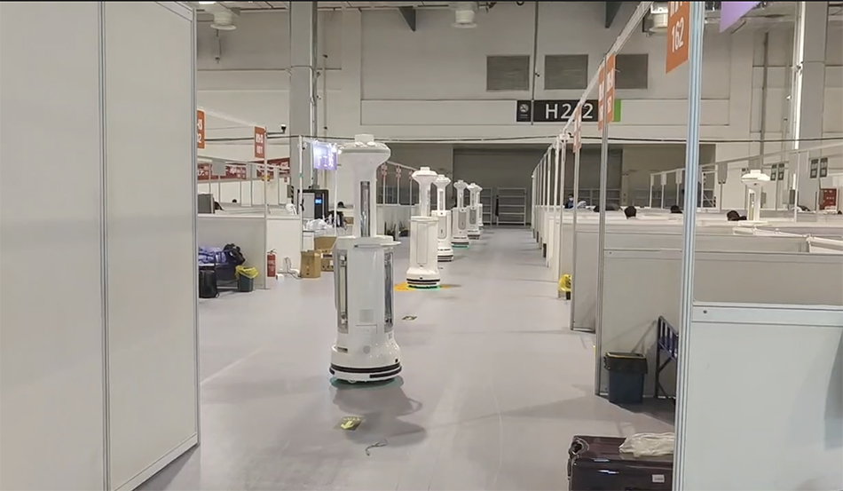 机器人们在上海世博展览馆方舱医院消毒、送餐、为患者跳舞休闲区蓝鸢梦想 - Www.slyday.coM