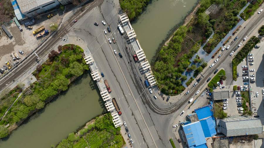 小清河上的桥丨济南西部的小清河，两座“断头桥”你走过吗？休闲区蓝鸢梦想 - Www.slyday.coM