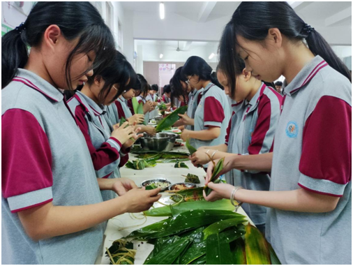 抚州市东乡区第三中学举办携手留守儿童包粽子庆端午活动|留守儿童