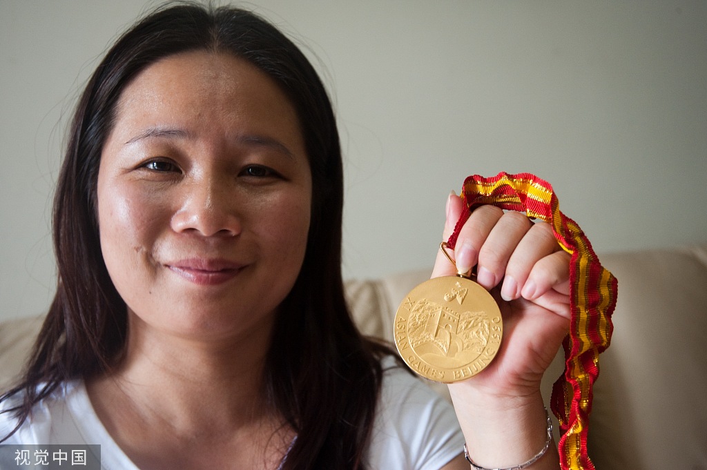 邢芬和她的亚运金牌。