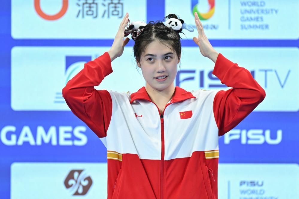 杭州亚运会·闲记丨泳帽掉了,他这次戴了两层