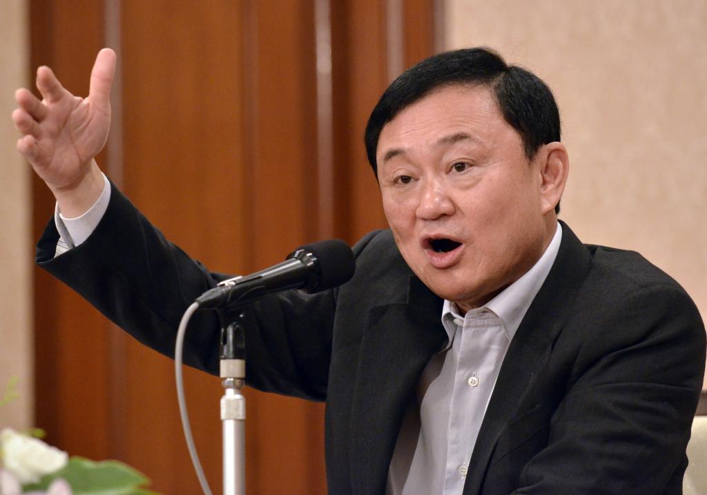 2011年8月23日,他信在日本东京出席新闻发布会.新华社发