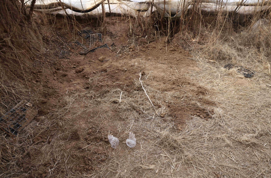 埋尸现场已被填平。 &nbsp;新京报记者 李英强 摄 