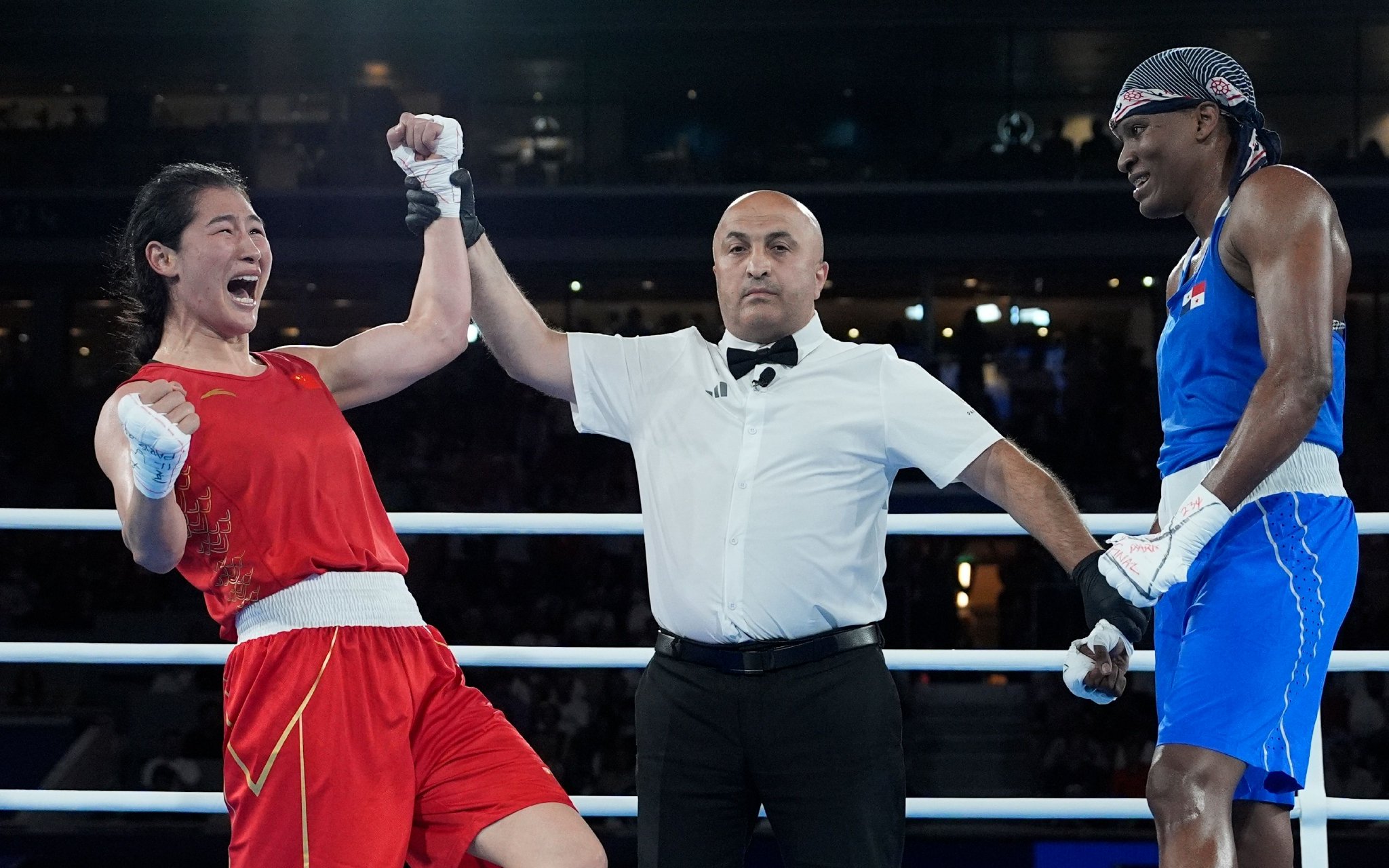 第三次征战奥运会，李倩（左）在巴黎笑到了最后。图/新华社