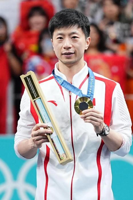 （已参加4届奥运会的马龙收获了自己的第6枚奥运金牌。中新社记者 赵文宇 摄）