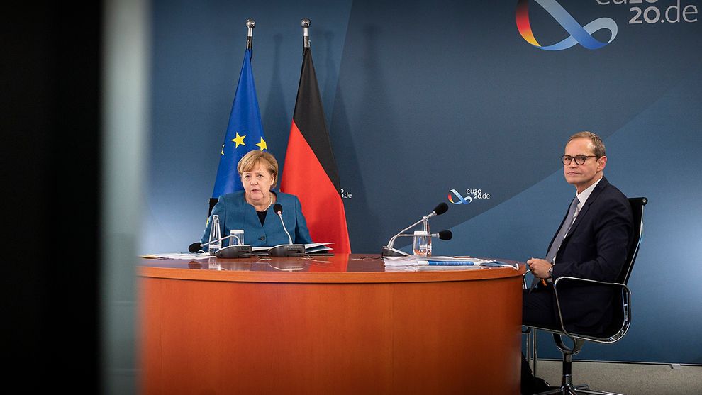 （△图为德国总理默克尔和柏林市长穆勒共同参加当天的视频“新冠峰会” 图片来自德国政府网站）