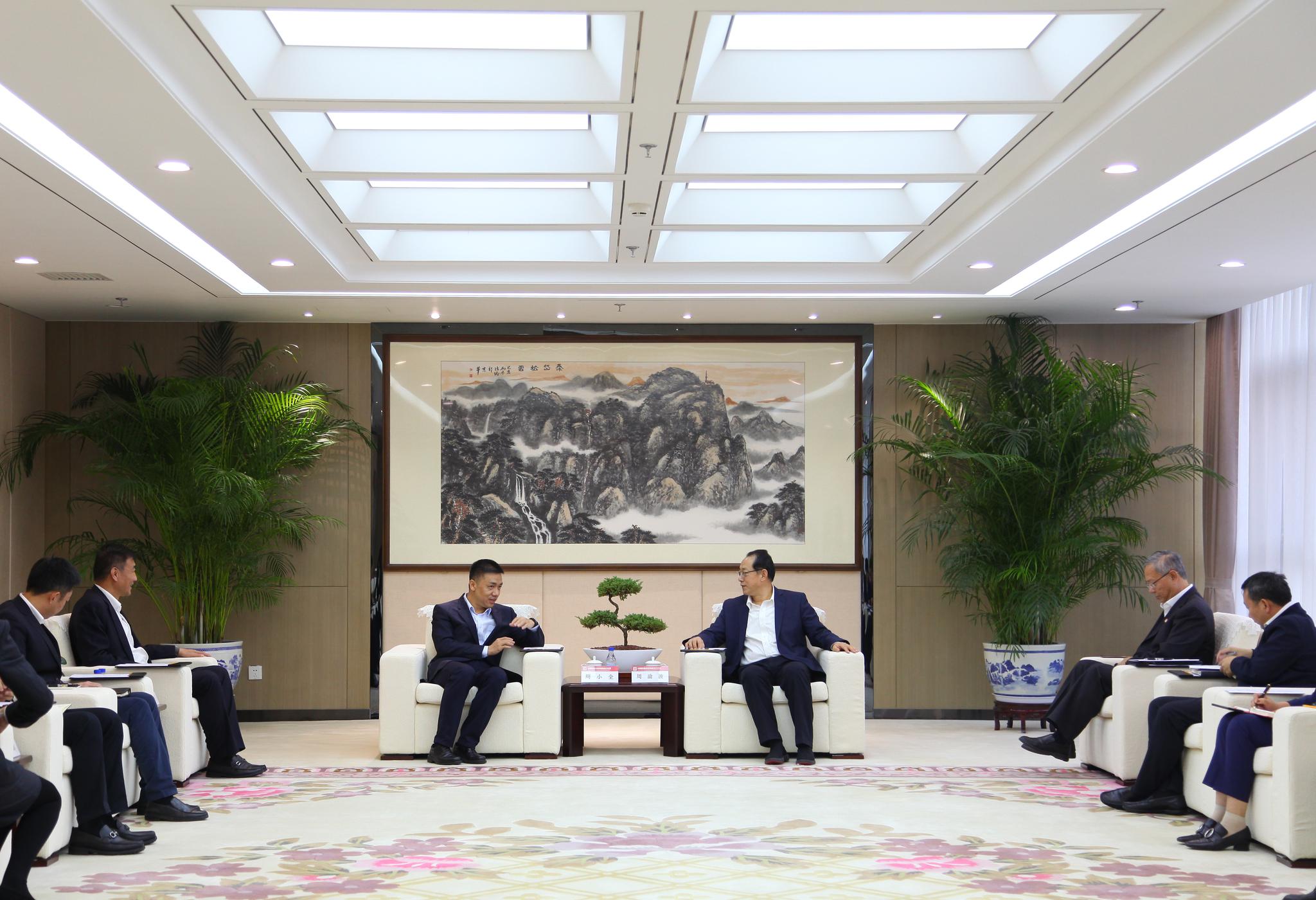 周渝波等会见上海联合产权交易所党委书记总裁周小全一行