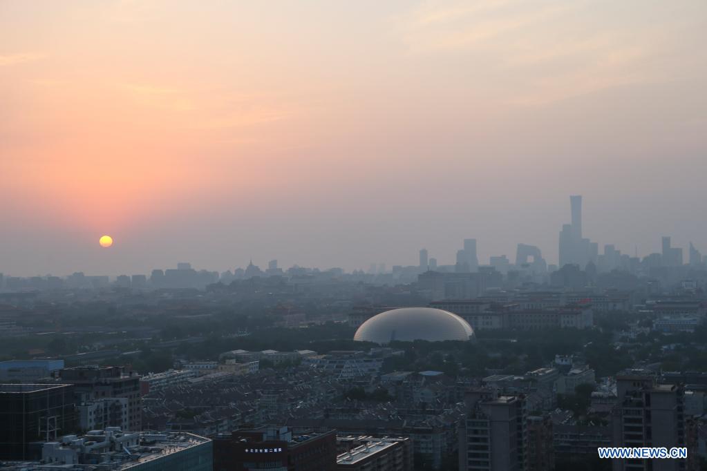 The sun rises in Beijing, capital of China, on July 1, 2021. (Xinhua/Li Mengjiao)