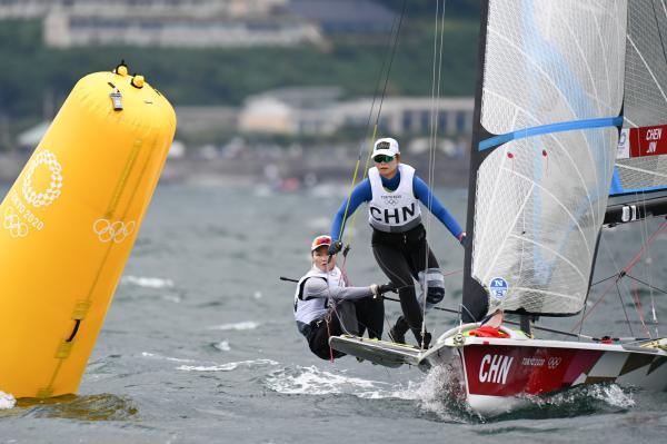 图说:金晔(右)与陈莎莎在奥运会比赛中.