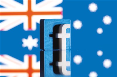 图为2月18日拍摄的3D打印的脸书标识和澳大利亚国旗。