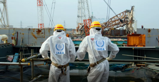 进入福岛核电站勘测的国际原子能机构人员。图片来源：IAEA