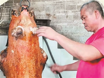 烧猪技艺三代传用心留住"家乡味"