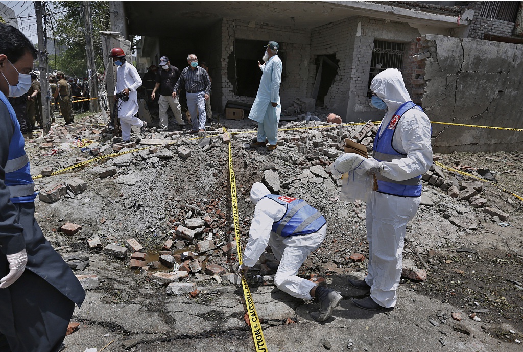 Investigators at the explosion site