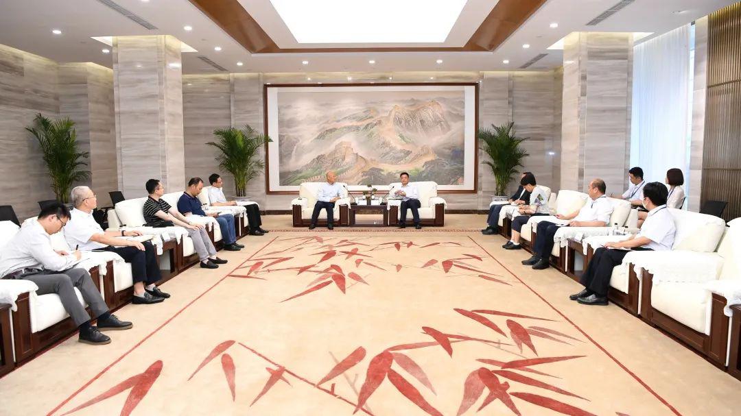 卡森董事长_俞培根会见卡森国际董事长朱张金